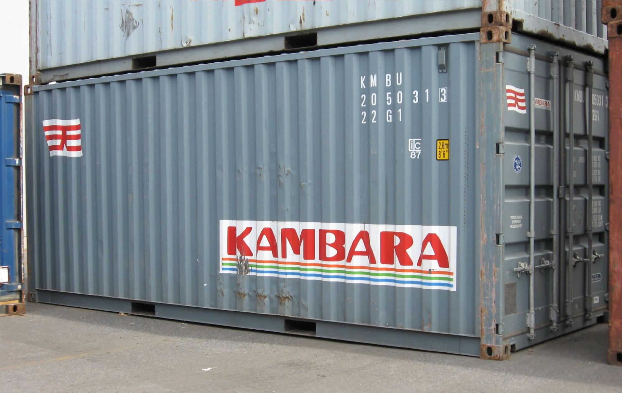 Kambara container marked 'KM BU' sits in the outdoor area