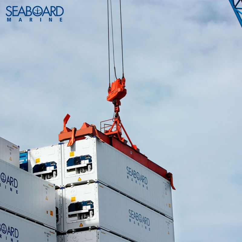 Seaboard Marine containers being loaded onto a ship by a crane